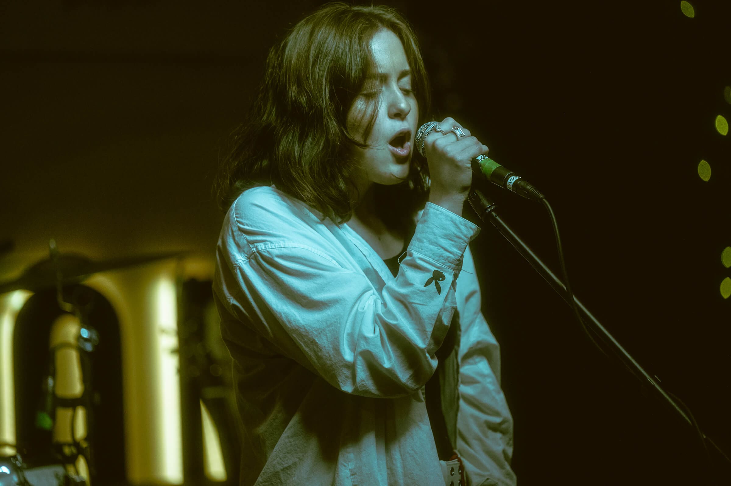 Sarah Cowan performing with microphone